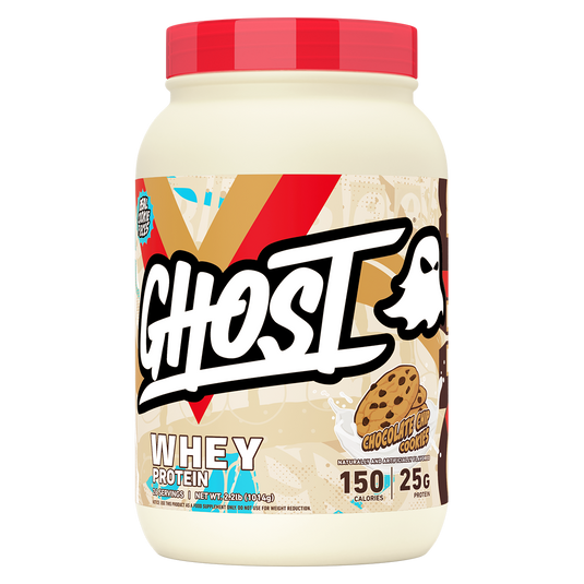 A tub of Ghost Whey Protein in Chocolate Chip Cookie flavor, featuring a red lid and a label with a large white Ghost logo on a beige background with red and brown graphic accents.