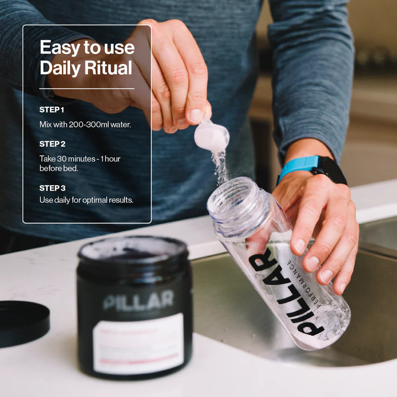 Load image into Gallery viewer, Person using a Pillar product with a bottle and container on a counter.
